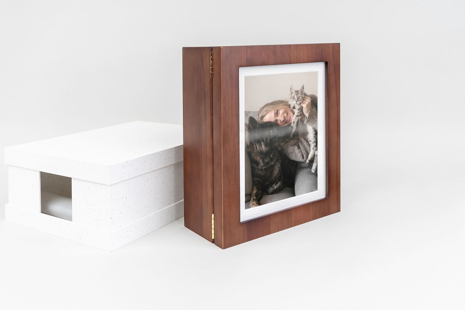 Wooden keepsake box with a framed photo of a cats  and dog displayed against a clean white background.