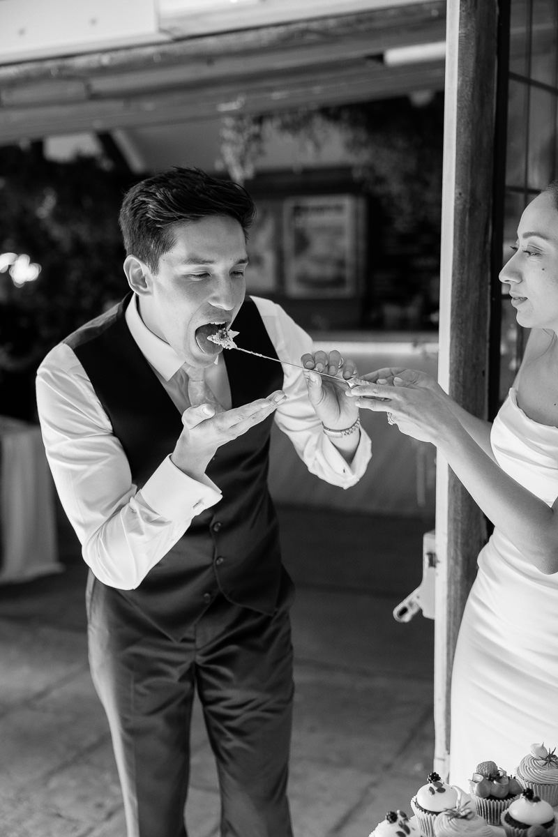 Black and white photo sequence showing someone in a vest and white shirt taking bites of food in multiple frames.