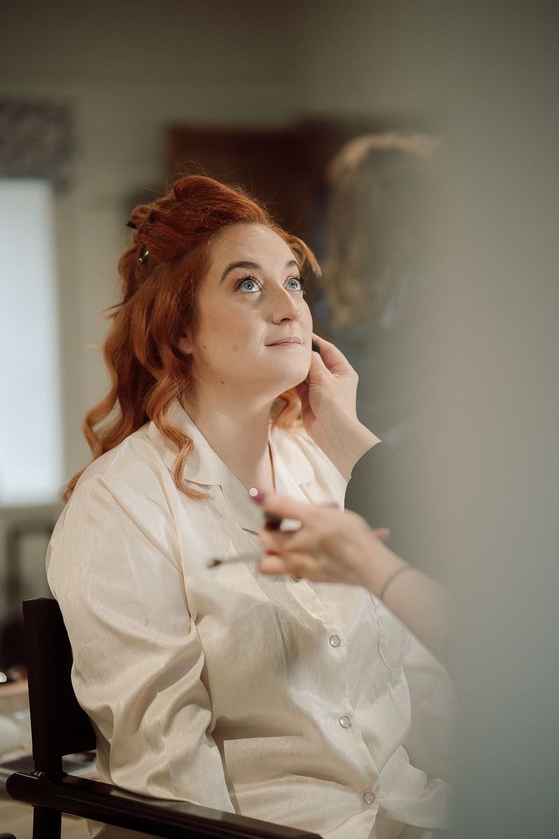 A dreamy portrait series shows a woman in a white blouse gazing thoughtfully upward in soft, moody lighting.
