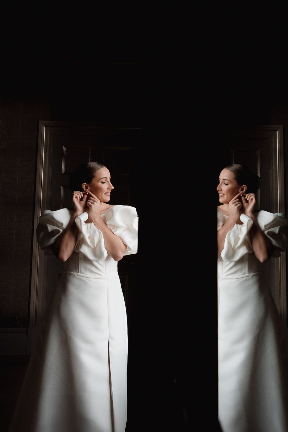 A dramatic fashion pose featuring a white sculptural dress captured in a sequence of artistic black and white frames.