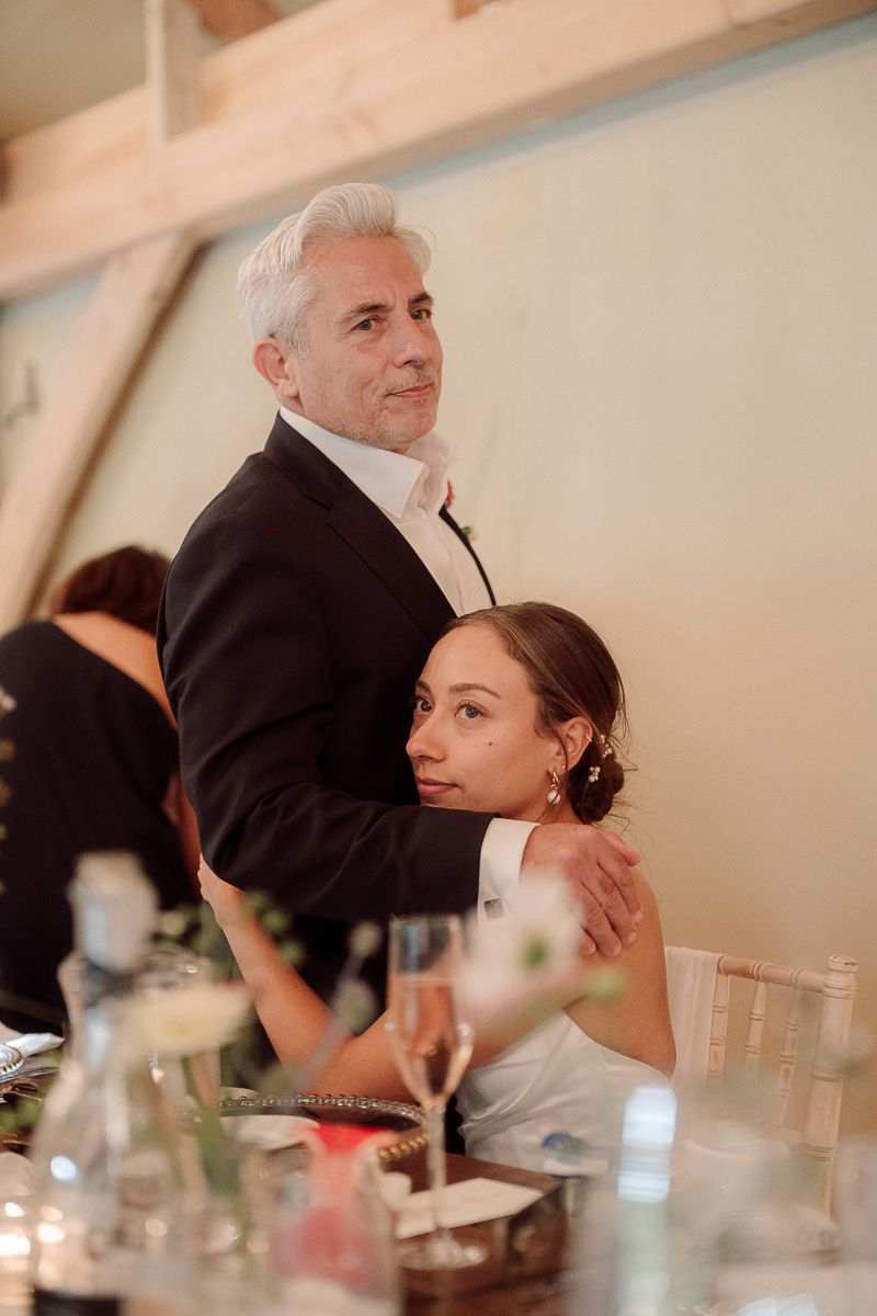 A sequence of candid moments captured at a wedding reception table showing tender interactions between guests.