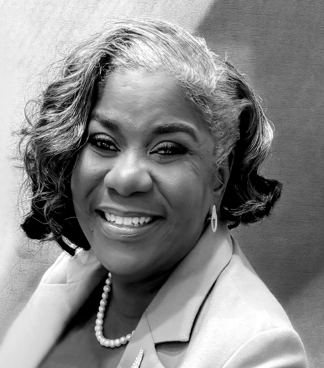 Black and white portrait series showing a woman in pearls and white clothing smiling warmly against a light background.