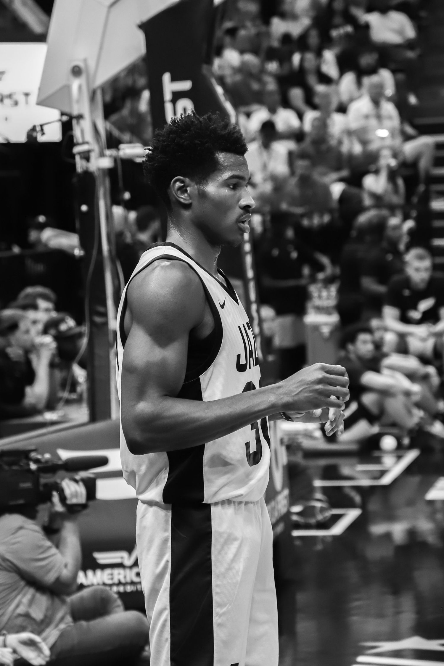 San Antonio Spurs player in black and white portrait during an NBA game at AT&T Center.