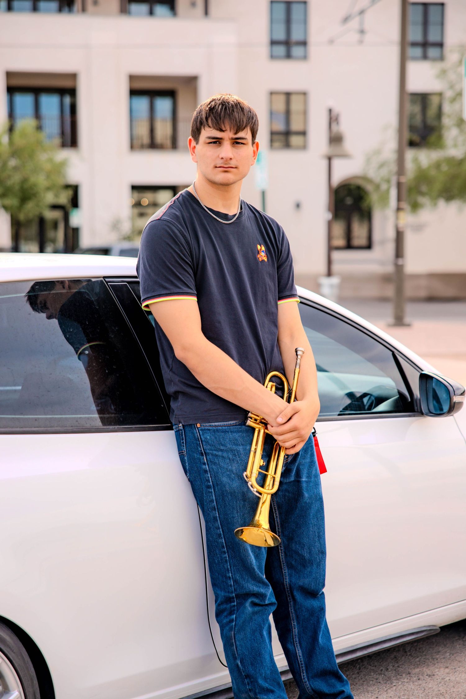 Multiple shots of someone in casual attire standing next to a parked white car.