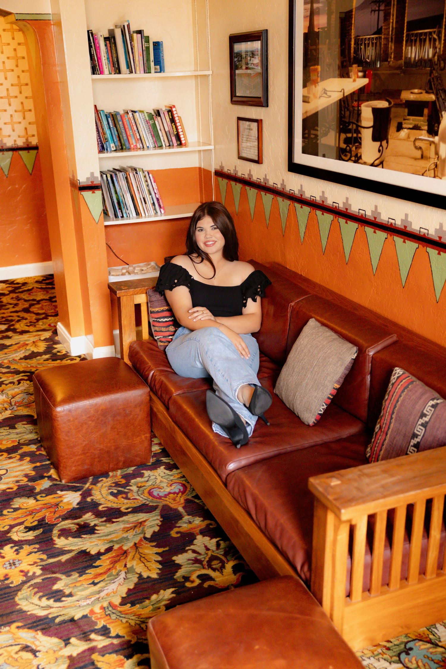 A sequence of photos showing someone lying down and relaxing on a brown leather couch in a room with bookshelves.