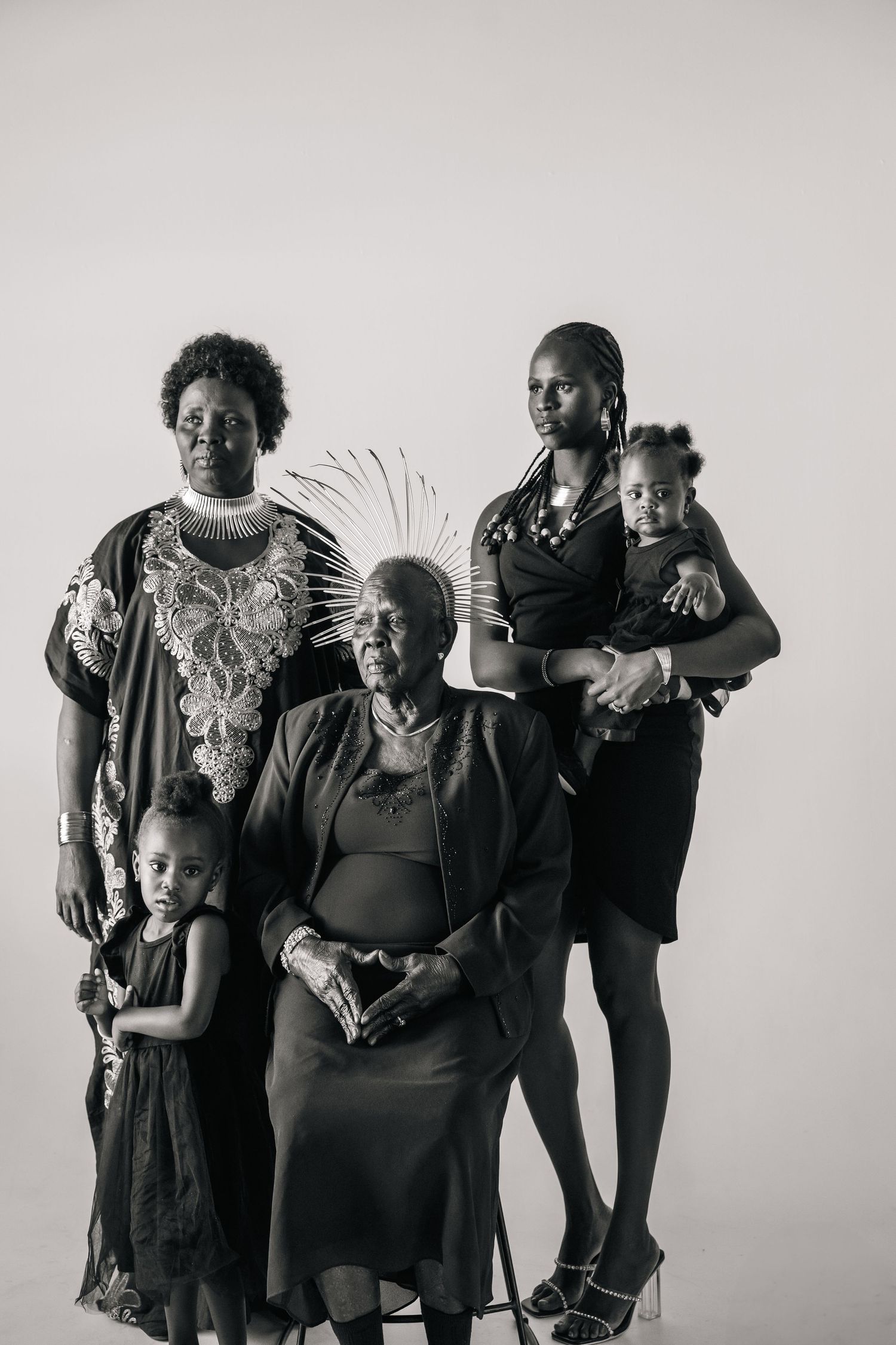 Multi-generational family portrait in black and white against a neutral background.
