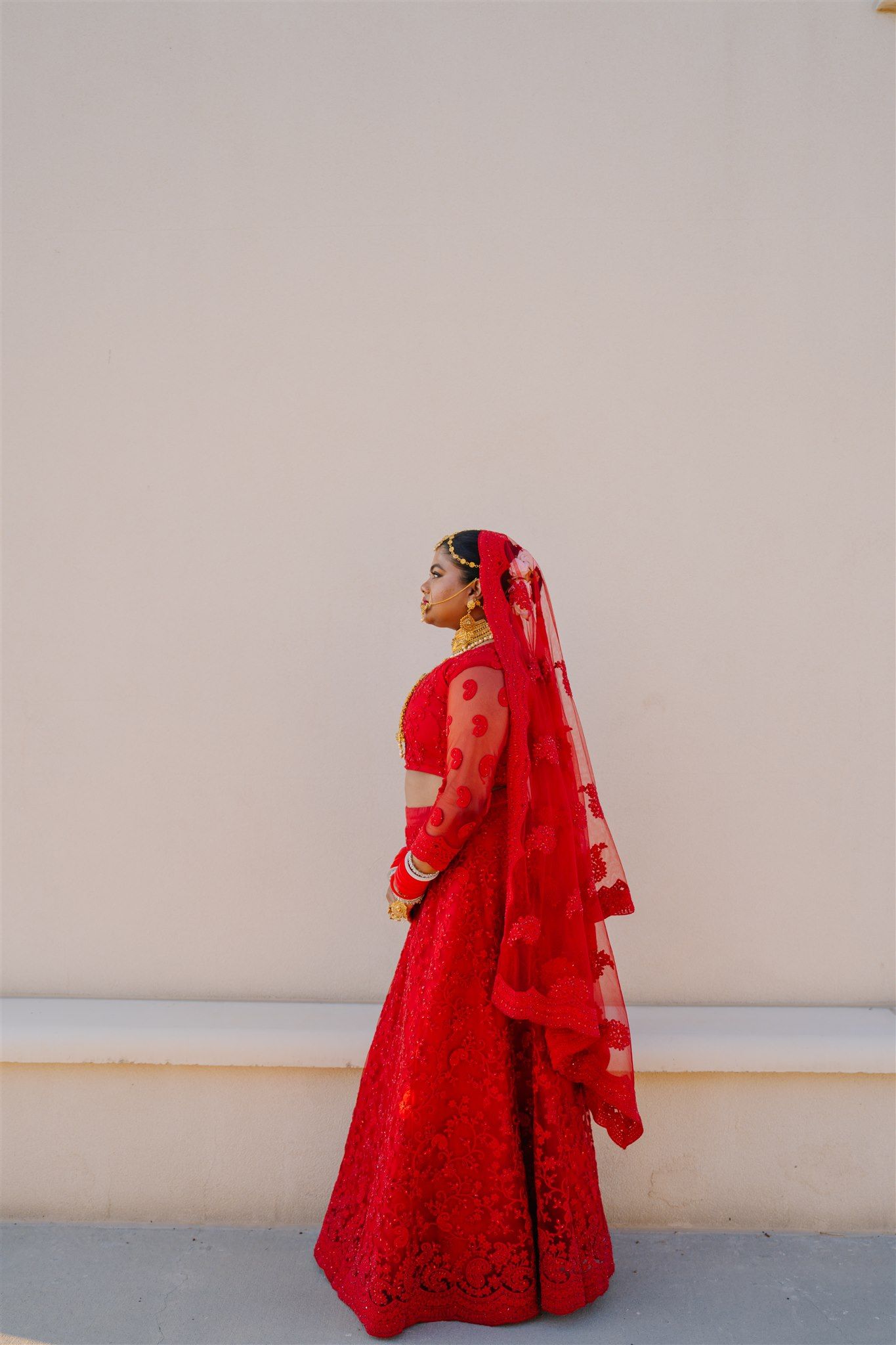 Modern portrait of woman in bold red outfit against neutral background – portrait photographer in Utah.