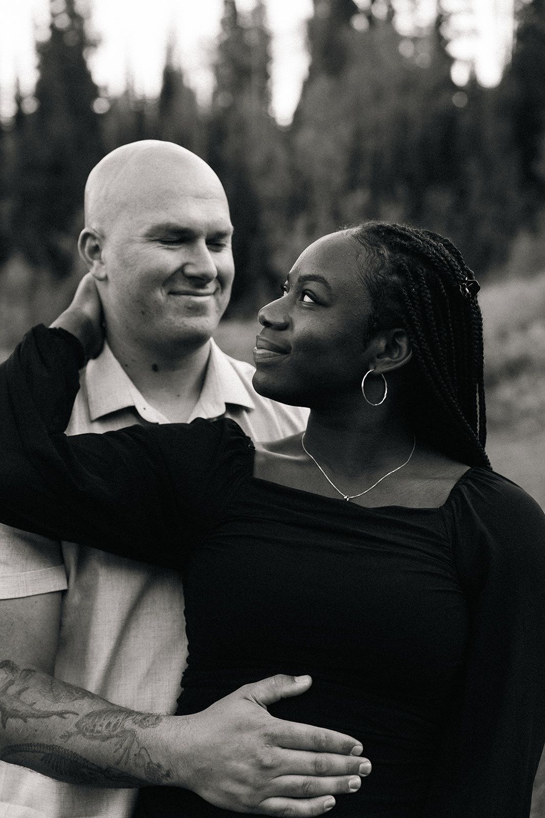 Black and white portraits capturing intimate moments between a couple.