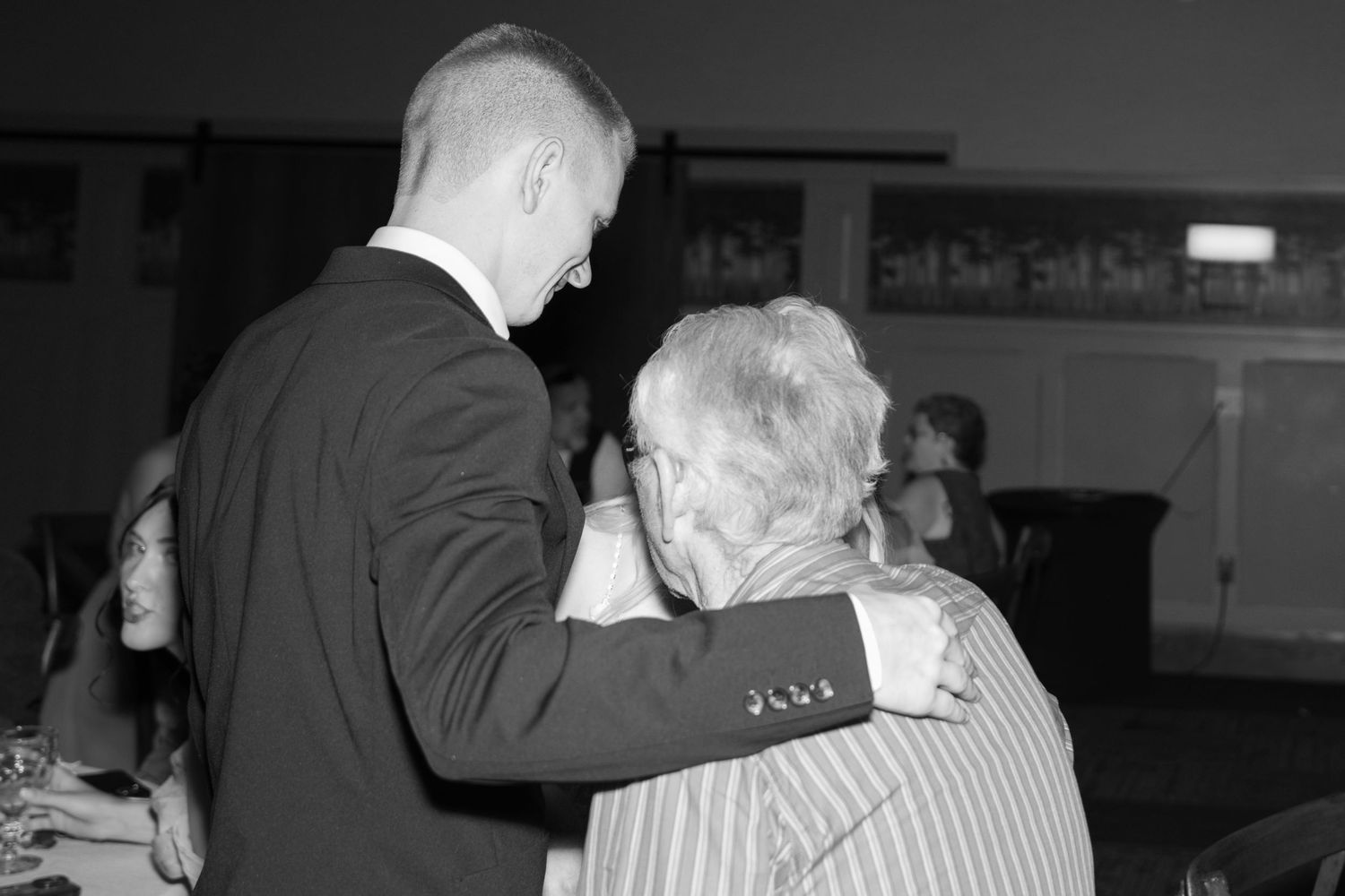 Black and white candid shots of wedding reception dance floor moments.