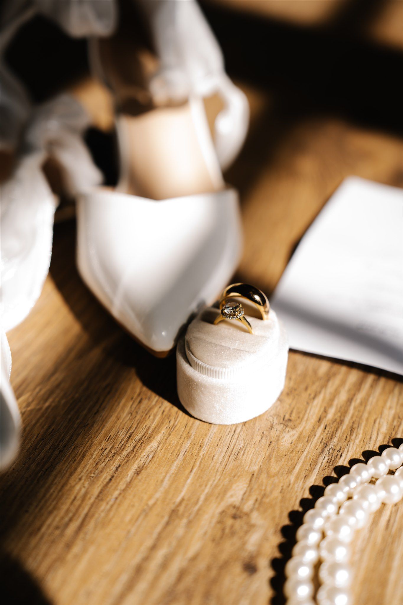 Close-up of wedding ring on velvet box with pearls — romantic bridal details photographed in Salt Lake City
