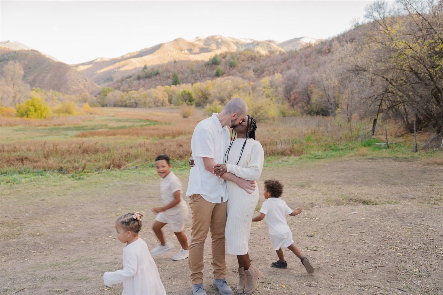 Desert landscape setting with family members walking together.