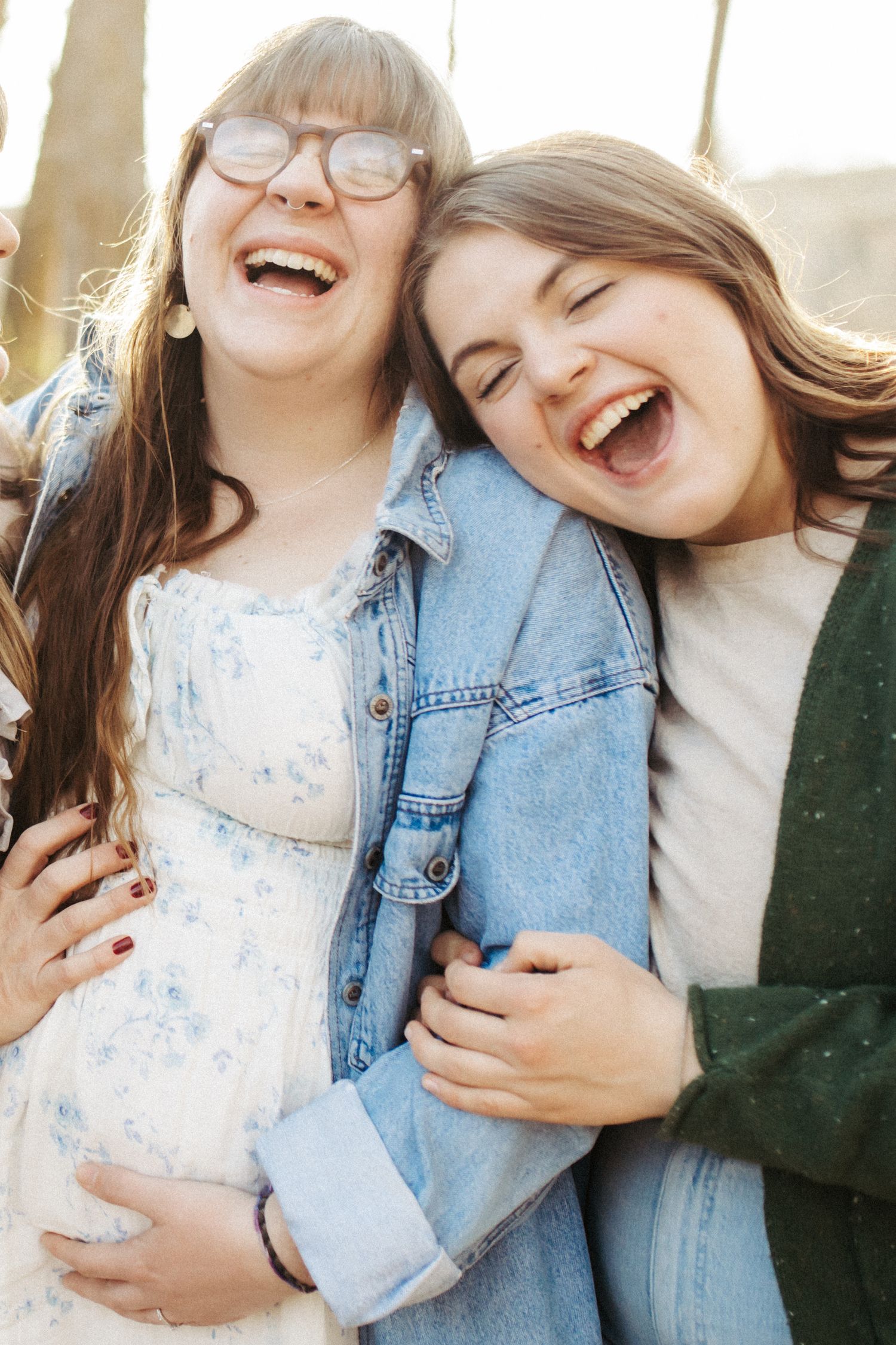 Candid family photograph of sisters laughing