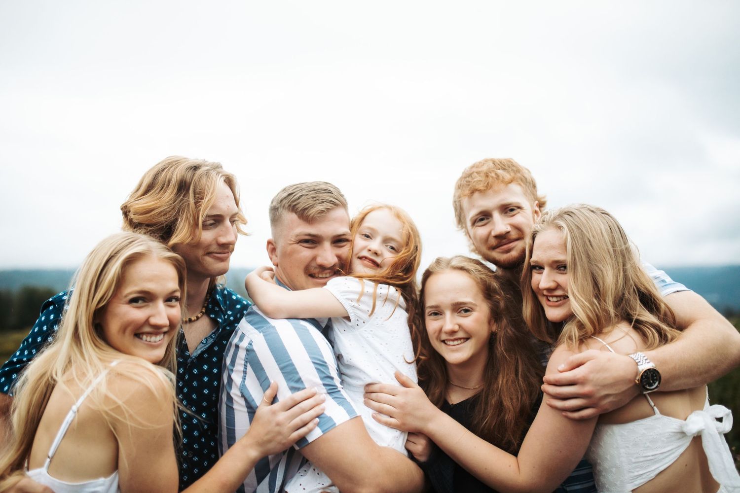 Siblings huddled together for a portrait
