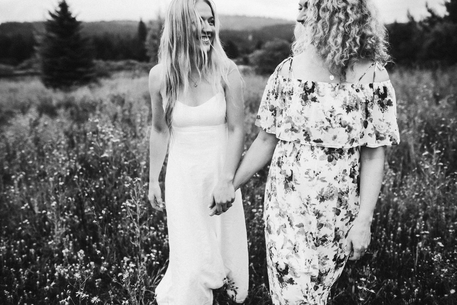 Mom walking with another eldest daughter for photos in cascade Idaho