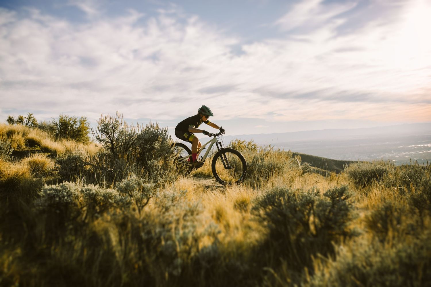 Senior photoshoot mountain biking in Boise