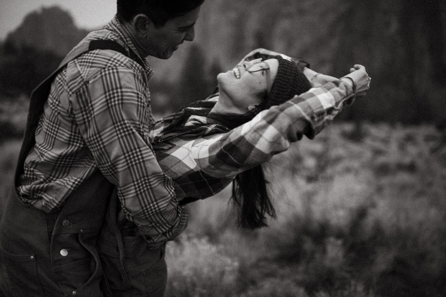 Playful black and white portrait of a couple in Smith Rock State Park