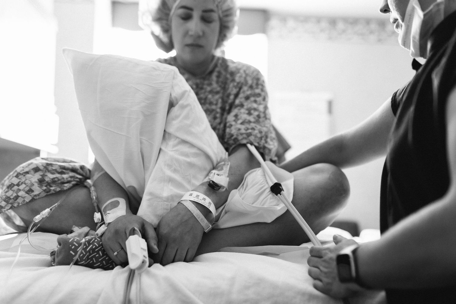 Birth photography of a mom holding her newborn in Boise