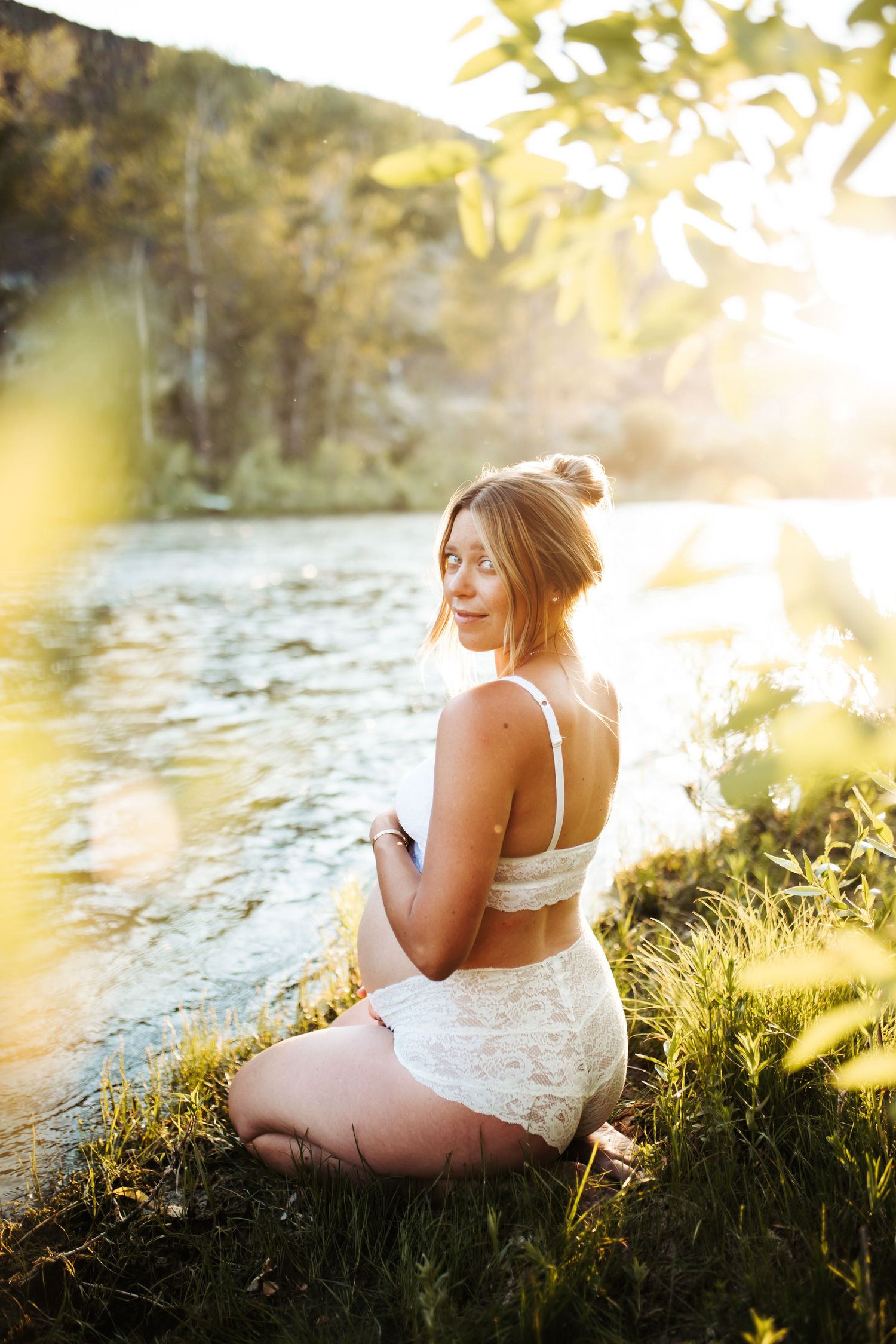 Artistic emotional image of a young woman for a maternity photoshoot along the Boise river