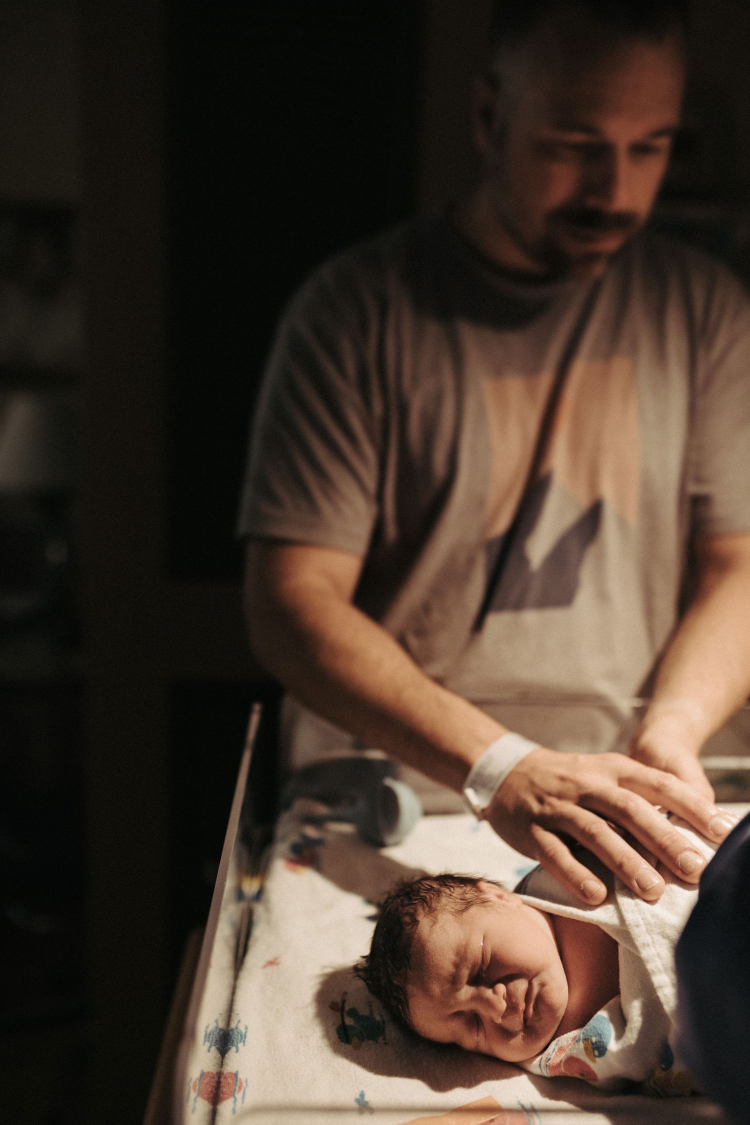Photograph of a newborn baby being weighed in Boise