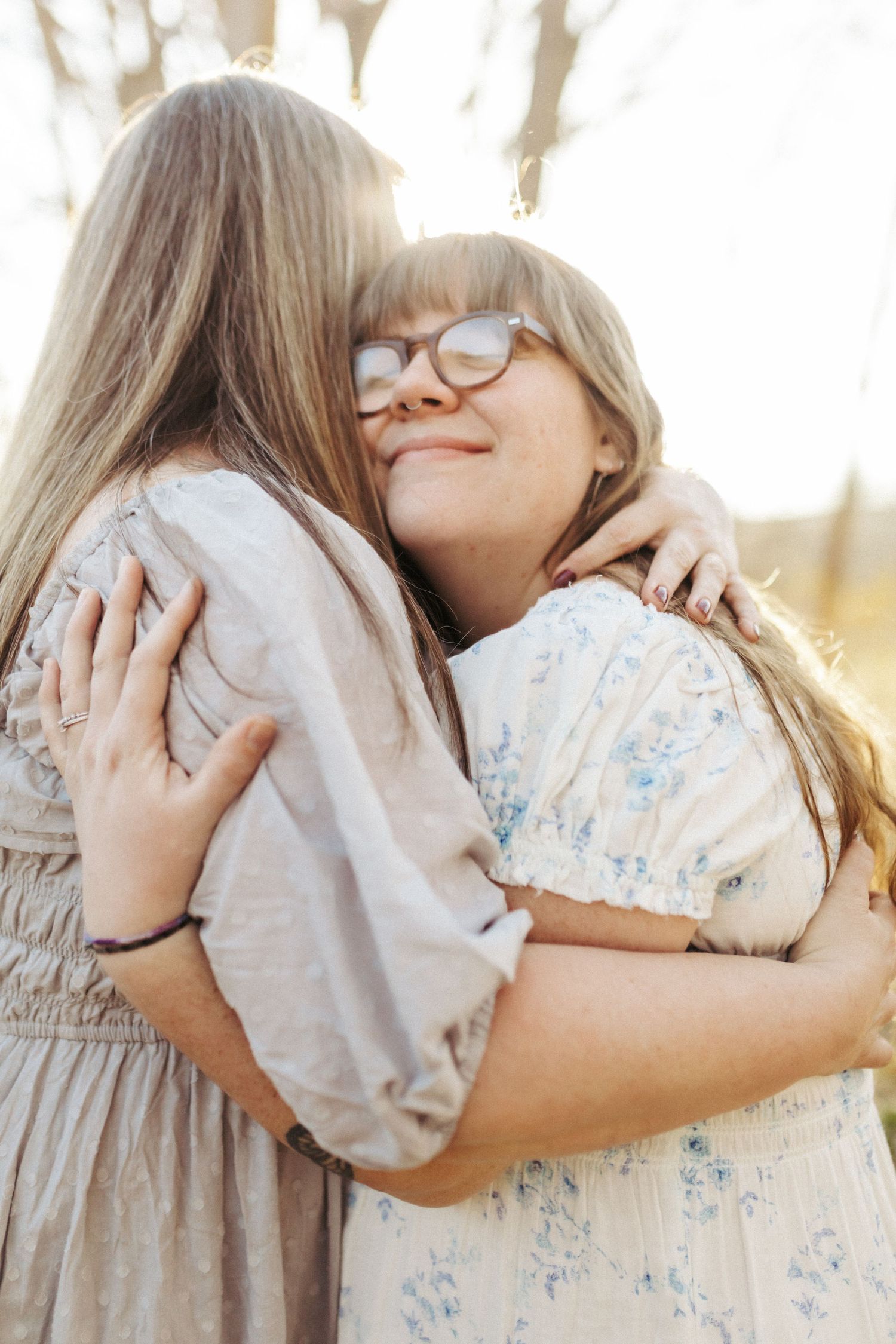 Mother hugging her daughter for a portrait