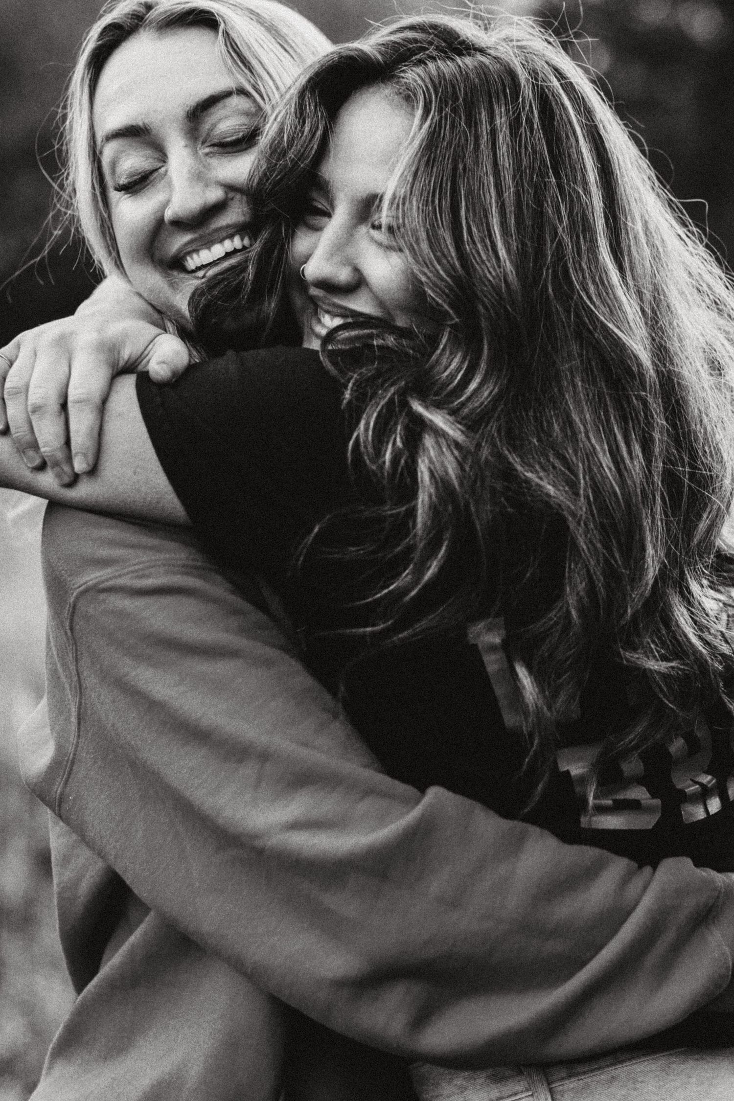 Candid image of mother and daughter hugging near Boise Idaho