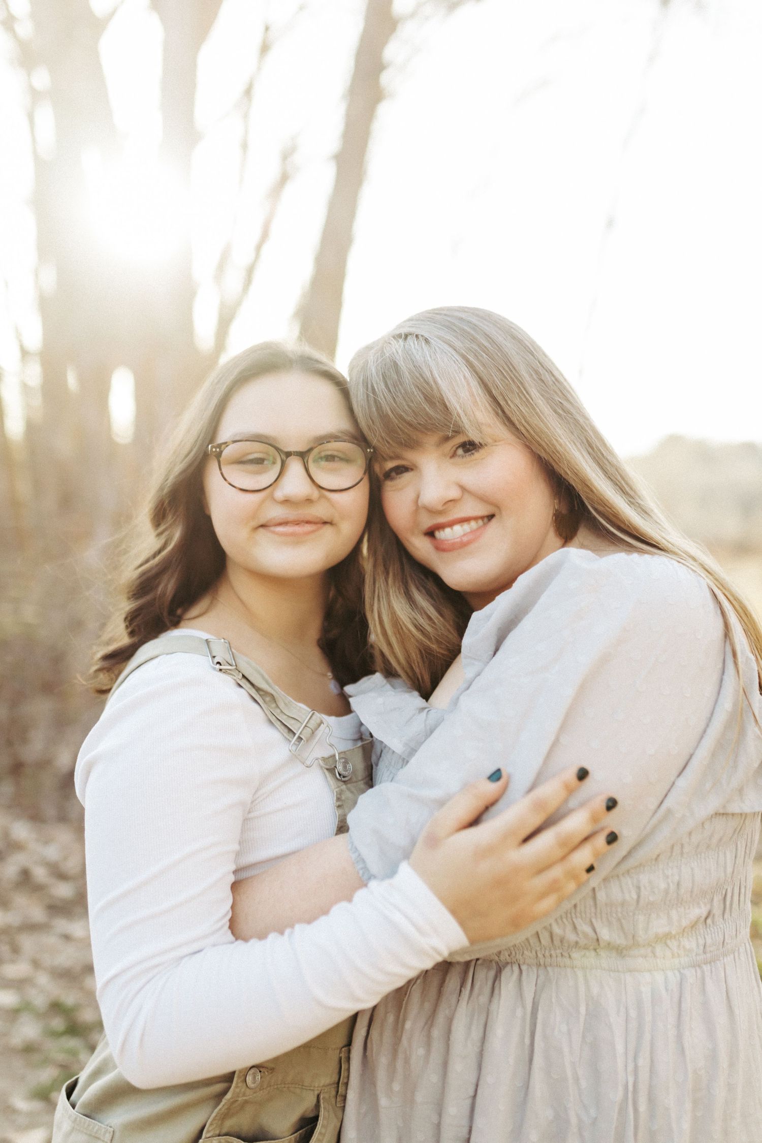 Mother and daughter hugging for family photos in Boise