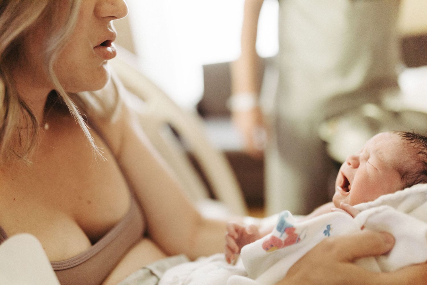 Image of mom comforting her newborn baby in Boise Idaho