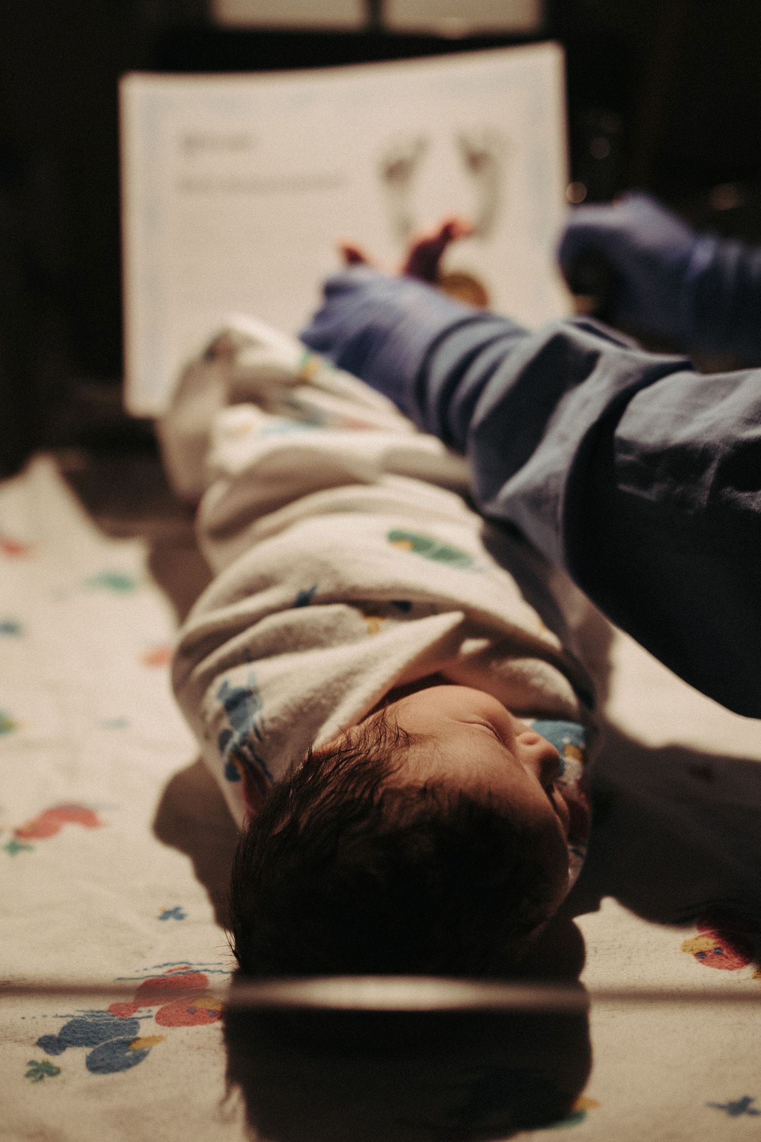 Photograph of a newborn baby being weighed and measured in Boise