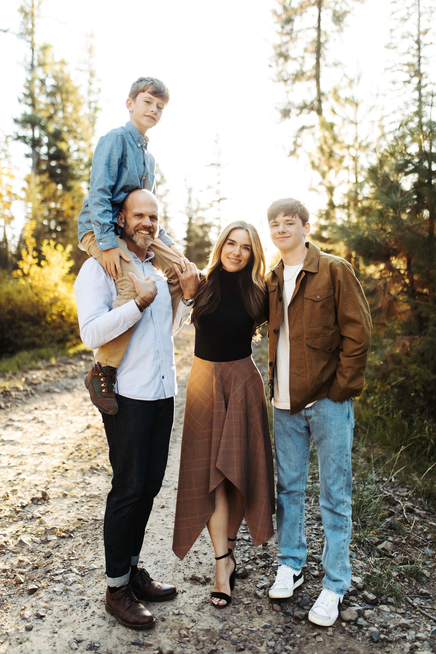 Family standing together for a portrait in the woods of McCall Idaho