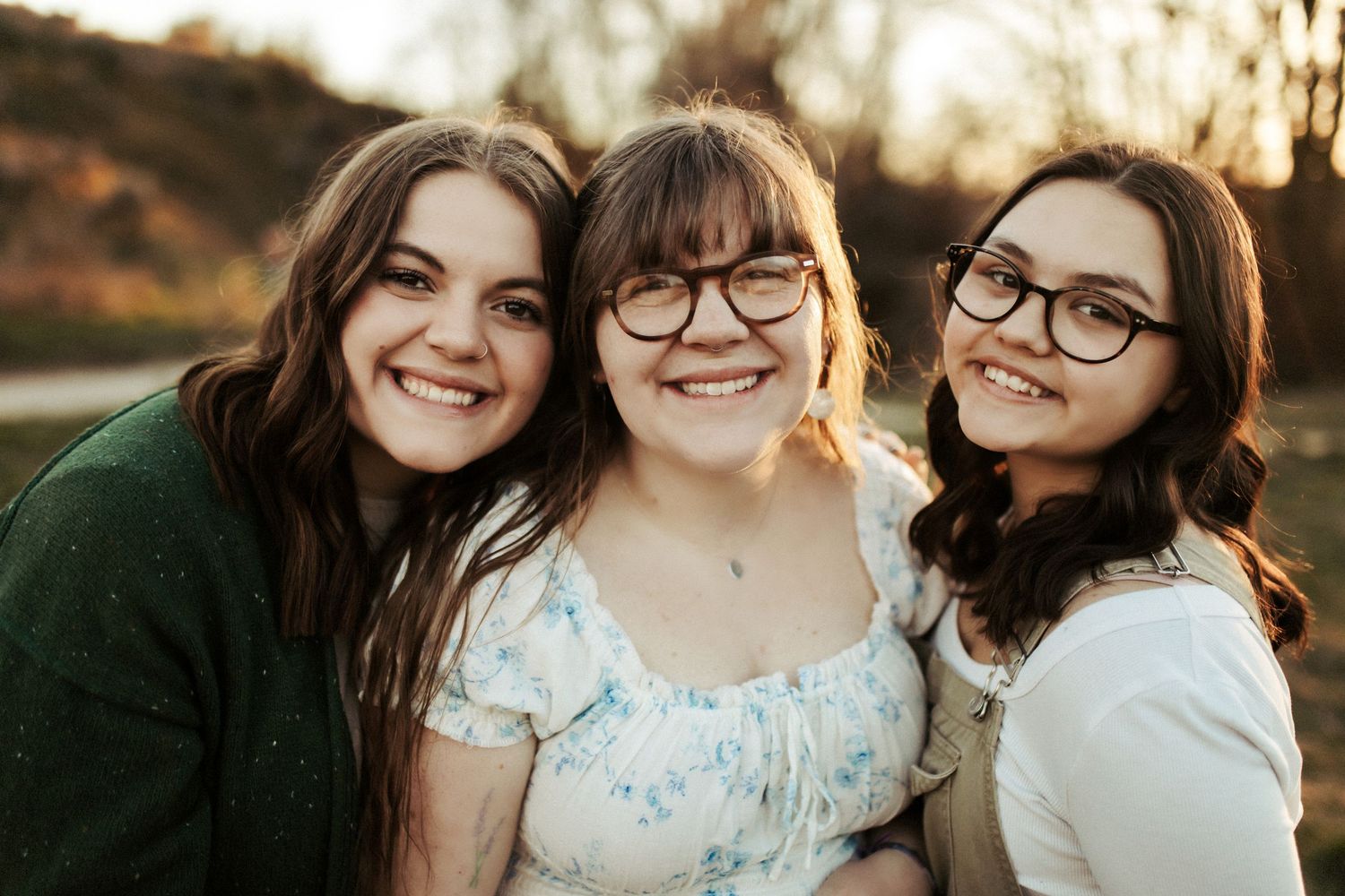 Sisters smiling together for family photos in Boise Idaho