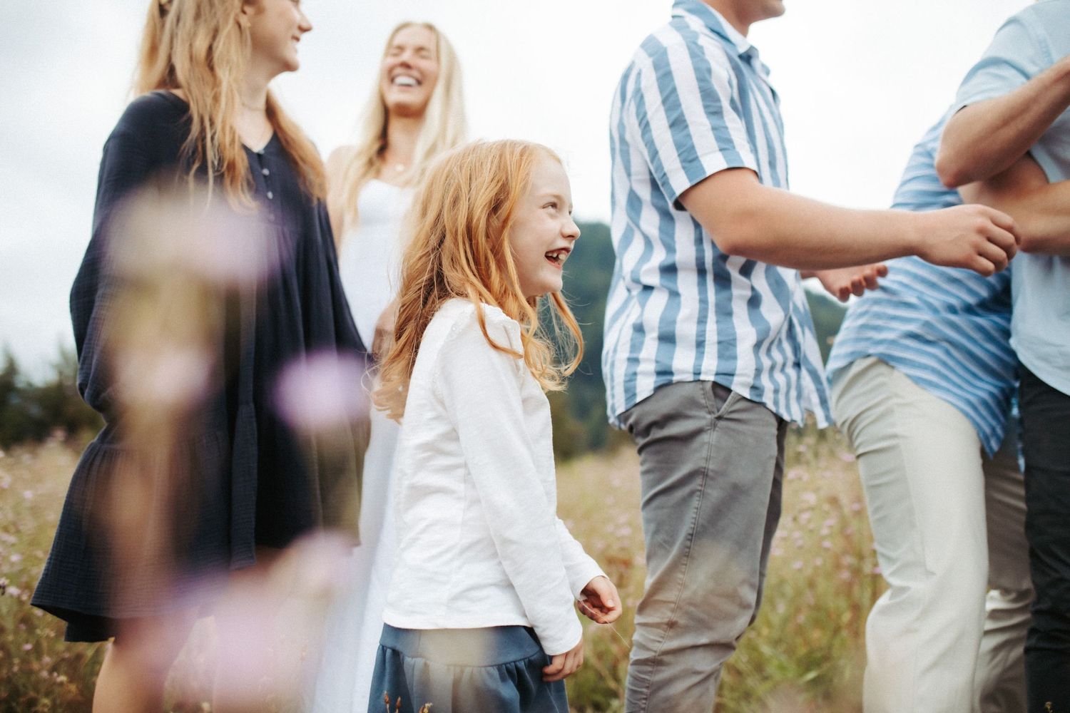 Candid image of a youngest sibling laughing