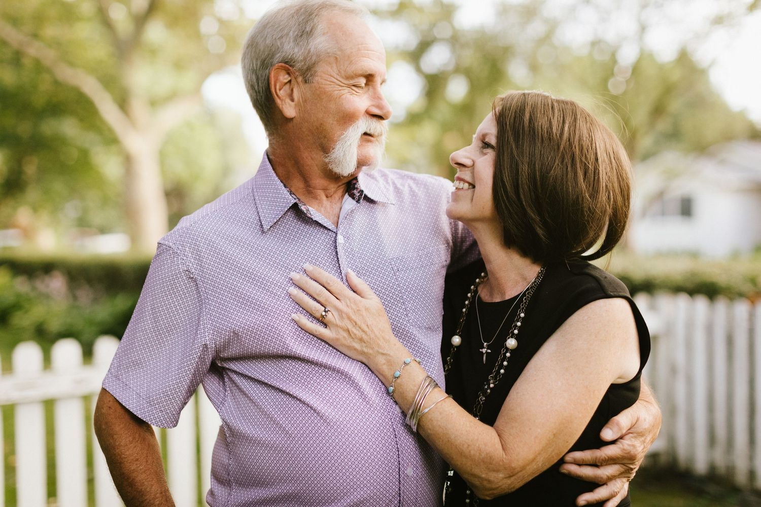 Couple posing closely together during a family photoshoot in the Boise North End