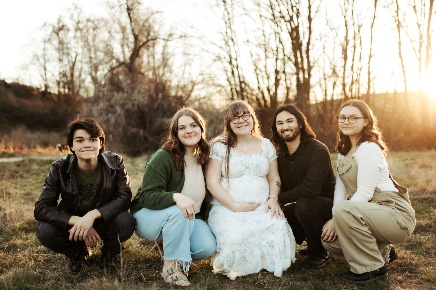Siblings sitting together for family photos in Boise