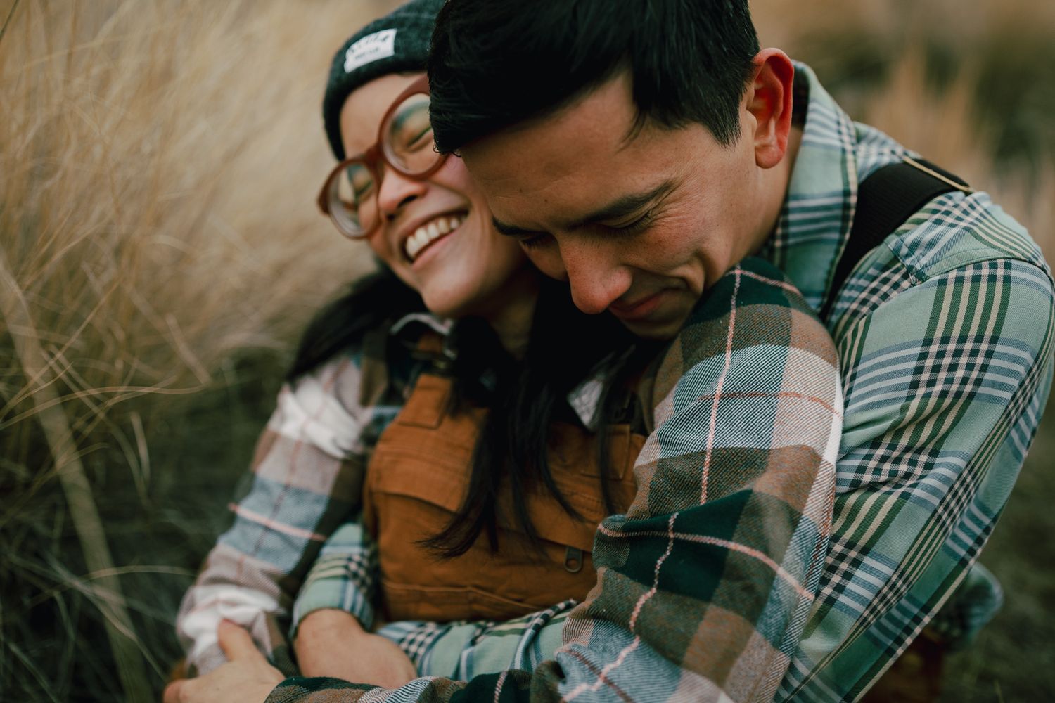 Couple sitting together intimately for photoshoot near Redmond Oregon