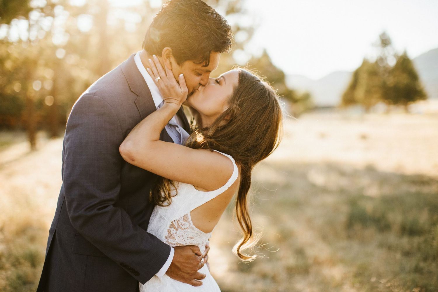 Bride and groom kissing for a photo at Shay Meadows Ranch in Big Bear California
