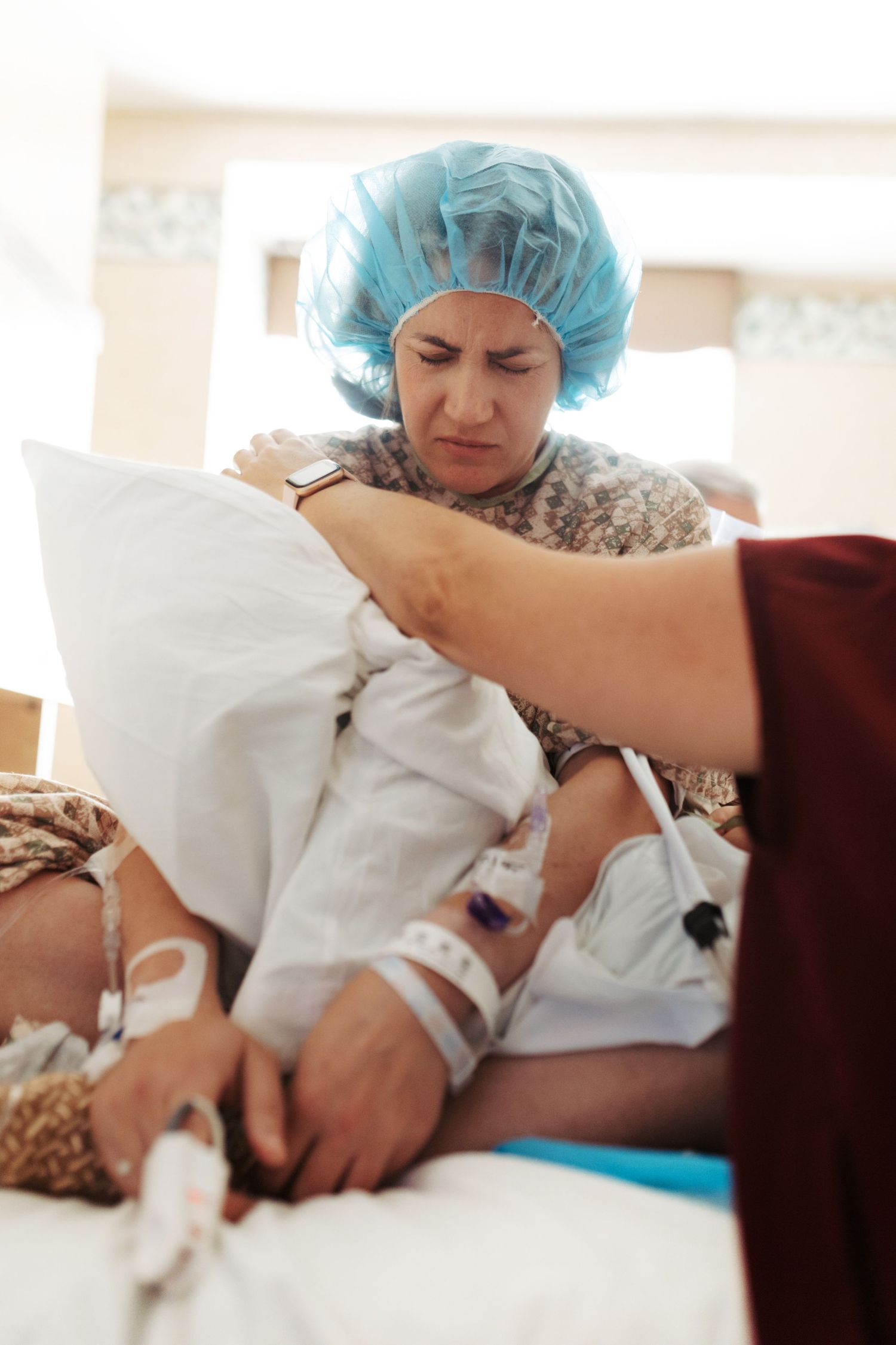 Birth photography of a mom holding her newborn in Boise