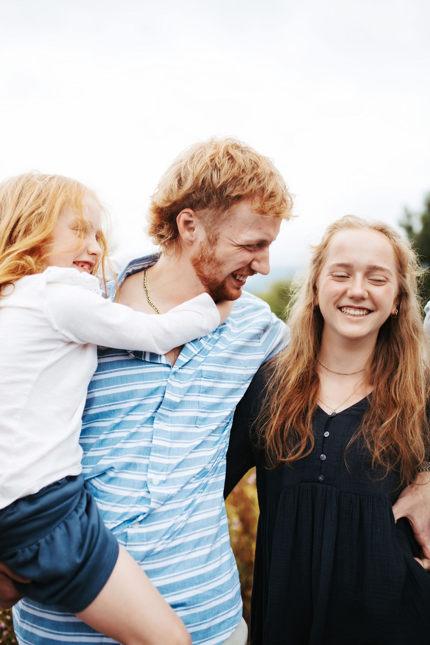 candid image of siblings laughing together