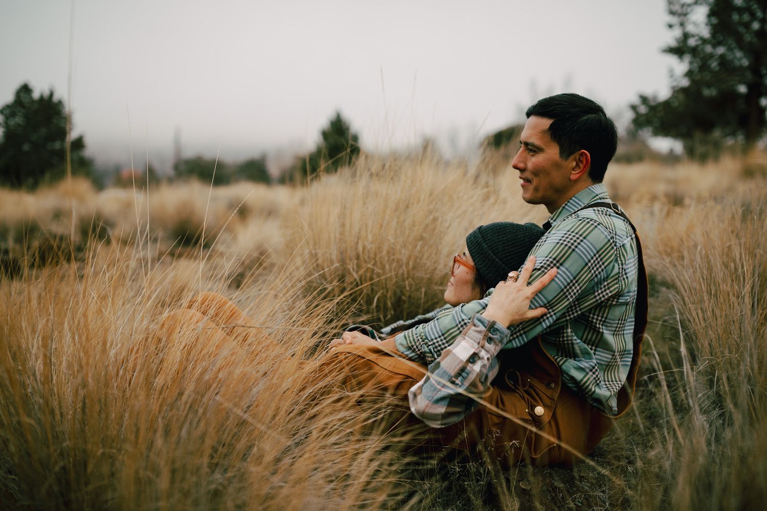 Couple sitting together for a photoshoot in Redmond Oregon