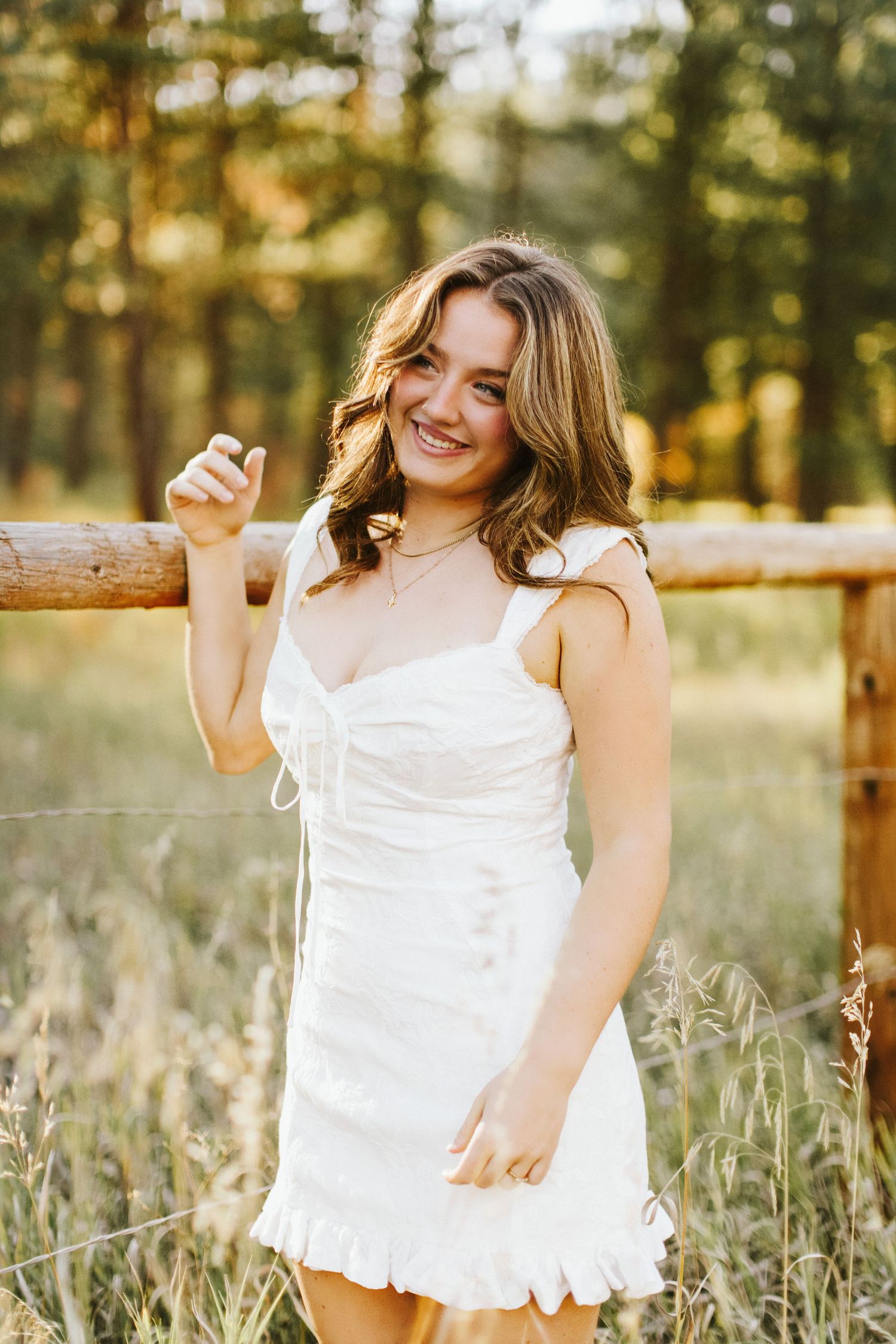 Young woman posing for her senior portraits at Robie Creek near Boise Idaho