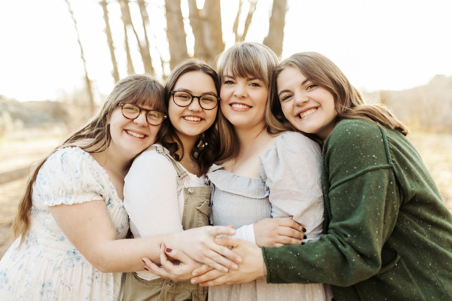 Mother standing with her daughters for family photos in Boise Idaho