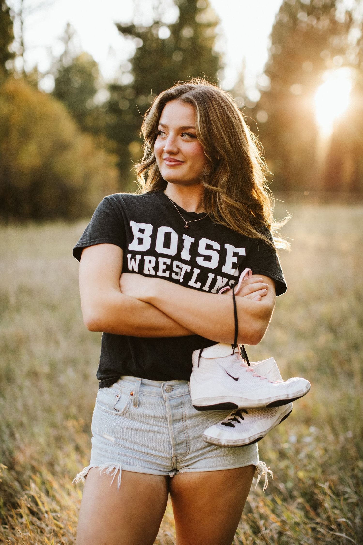 Young woman posing for her senior portraits at Robie Creek near Boise Idaho