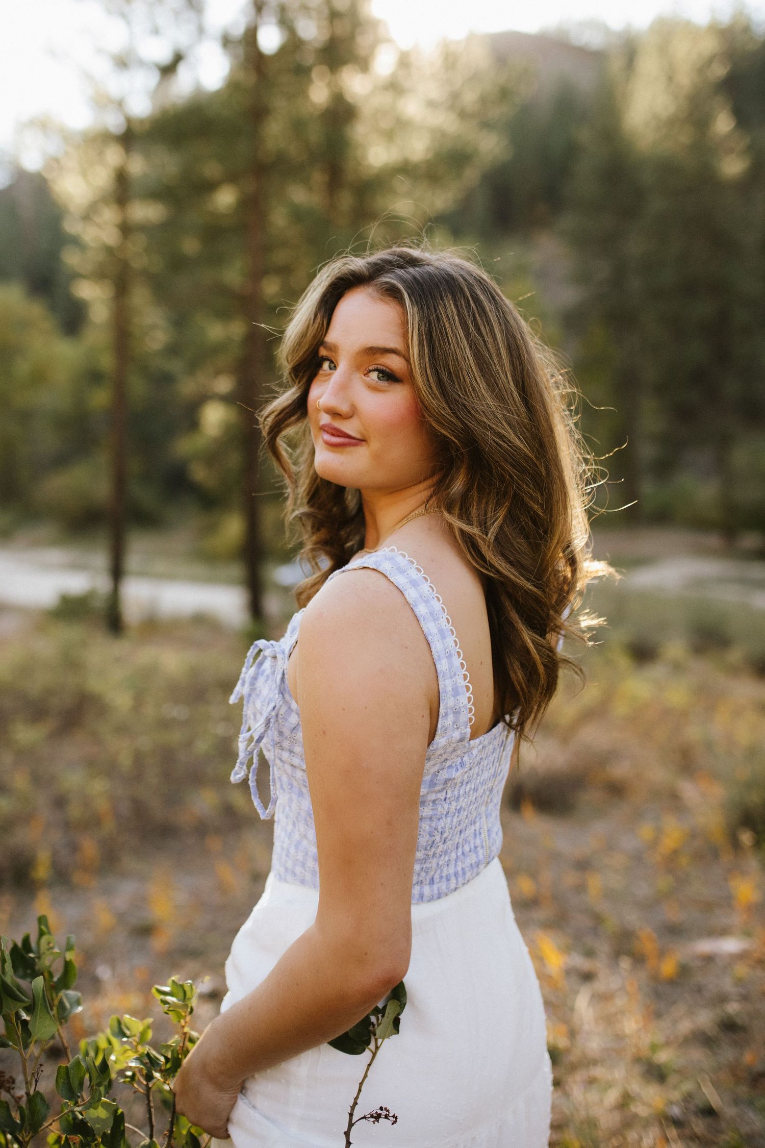 Posed portrait of young woman for senior photoshoot at Robie Creek