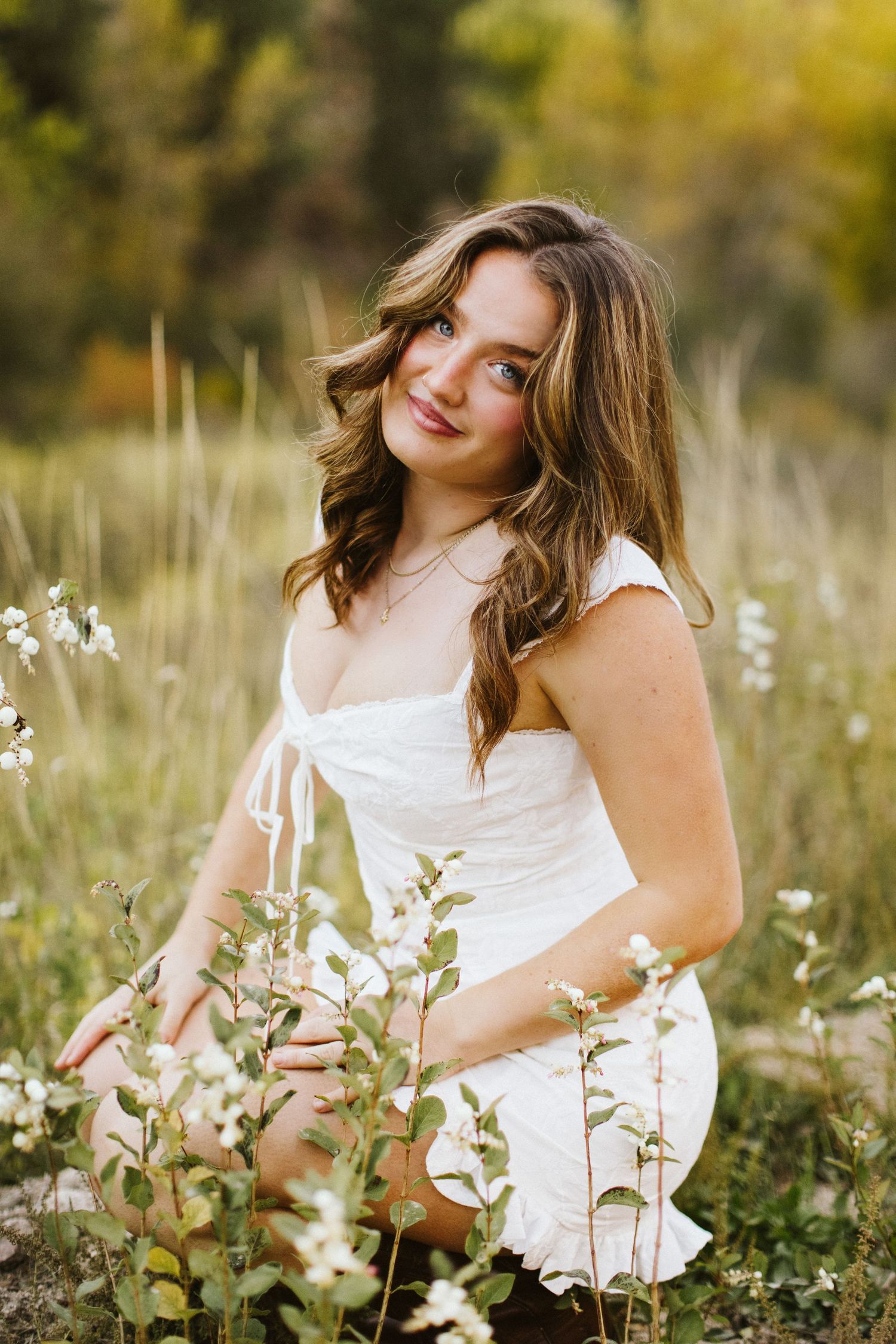 Posed portrait of young woman for senior photoshoot at Robie Creek