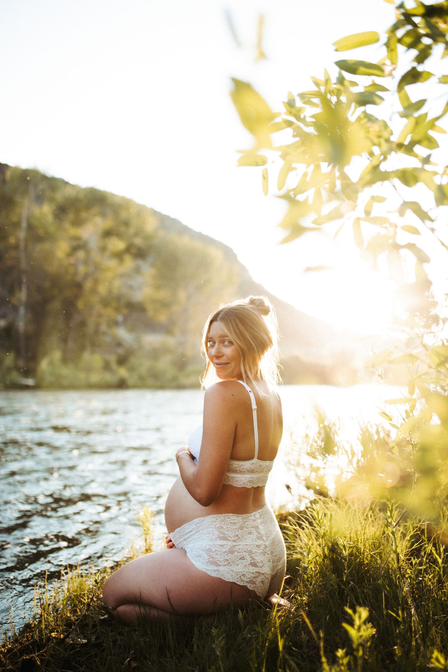 Artistic emotional image of a young woman for a maternity photoshoot along the Boise river