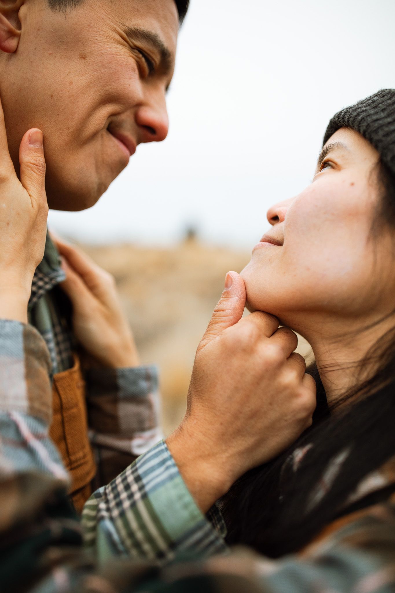 Couple standing together admiring each others faces for a photoshoot in Redmond Oregon