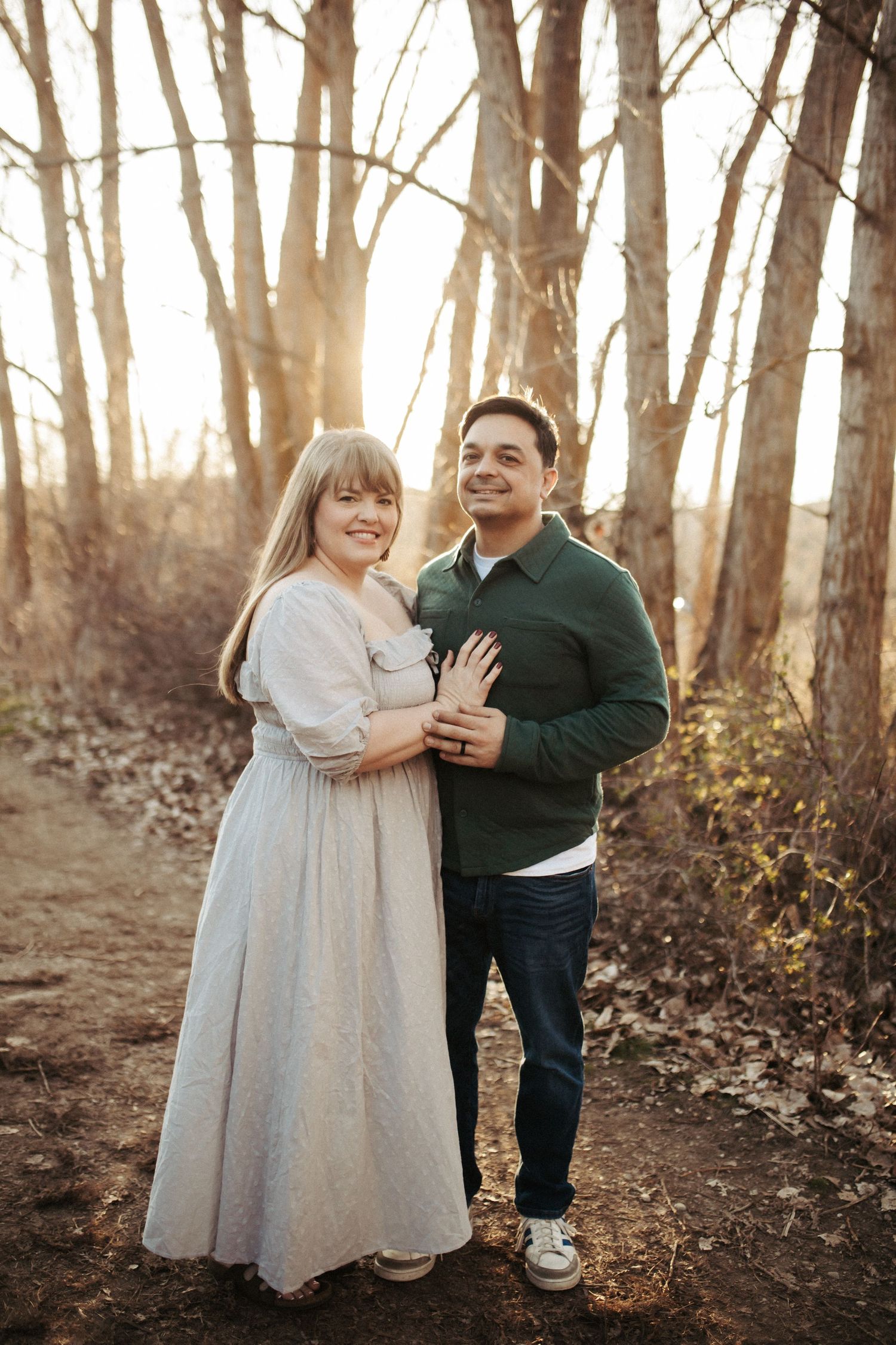 Wife and her husband standing for family photos in Boise Idaho