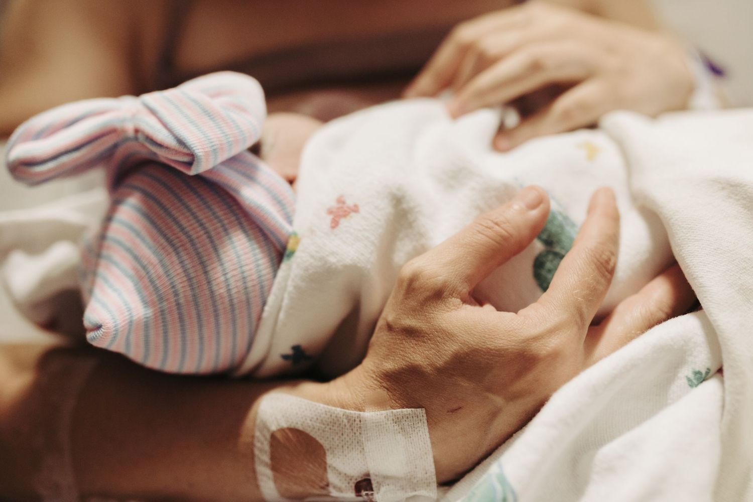 Birth photography of a mom holding her newborn in Boise