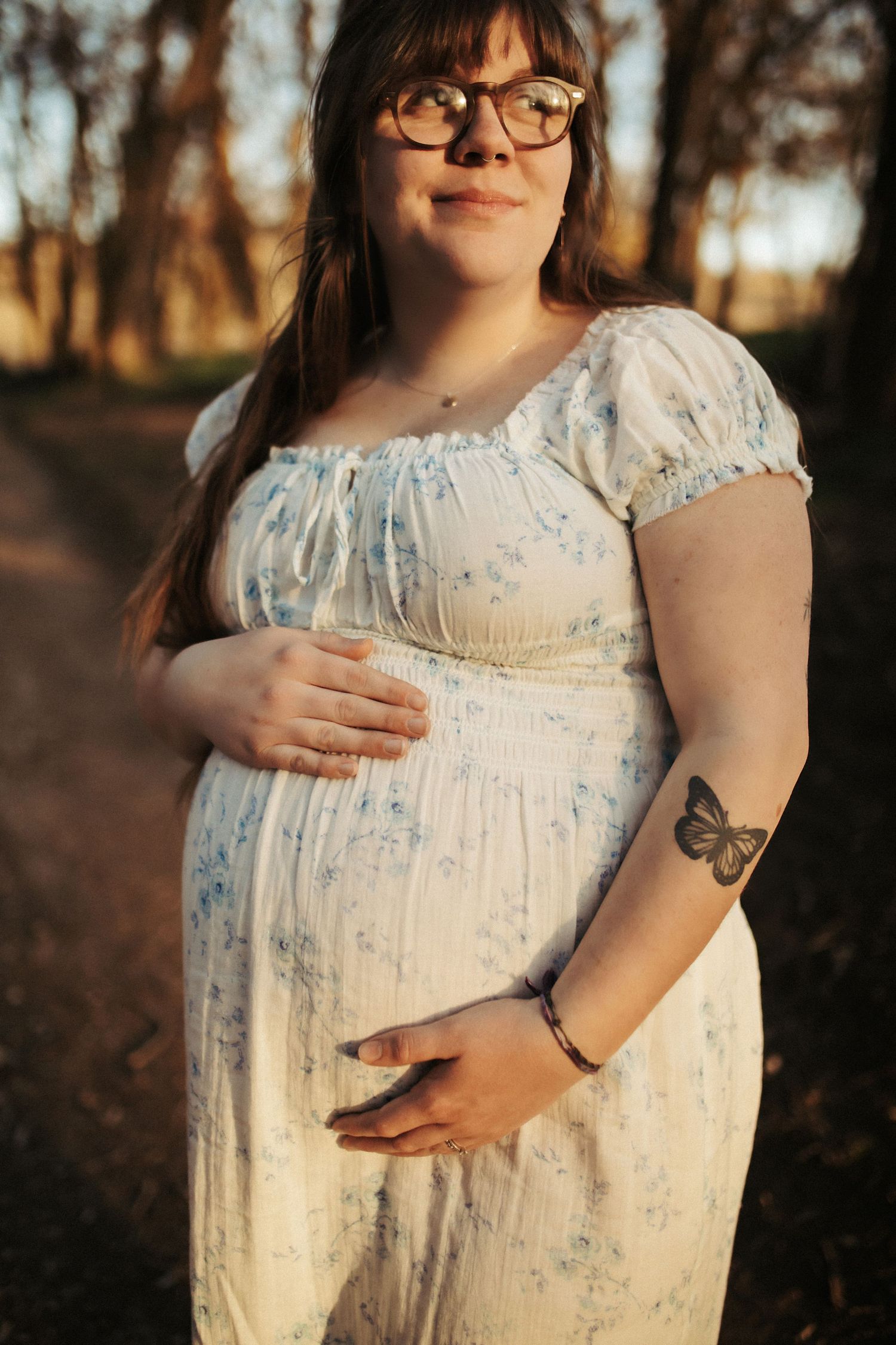 Image of a women standing for maternity photos in Boise Idaho