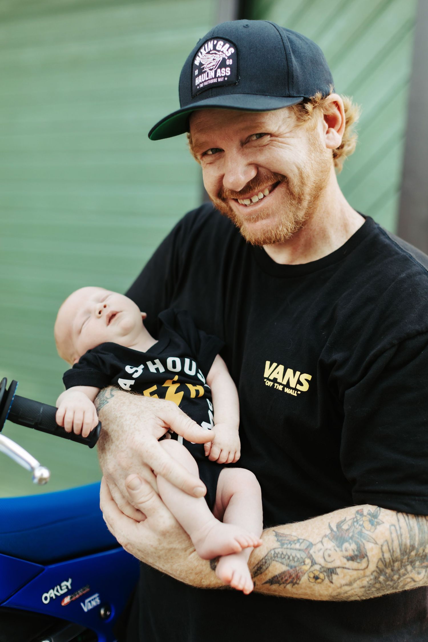 Dad holds newborn son for photoshoot at home in Boise Idaho