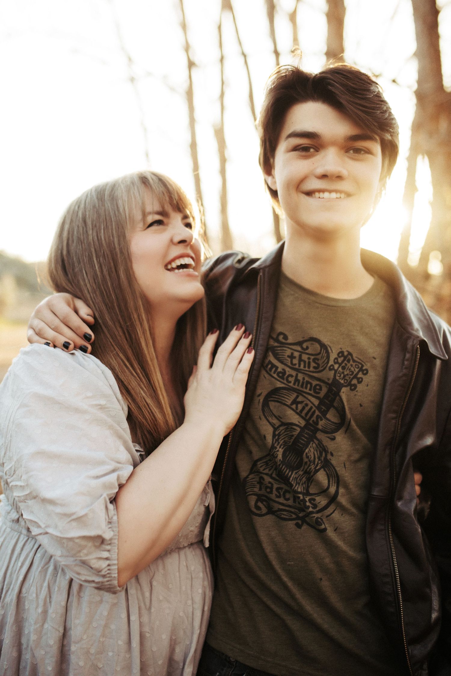 Mom laughing with her son for family photos in Boise